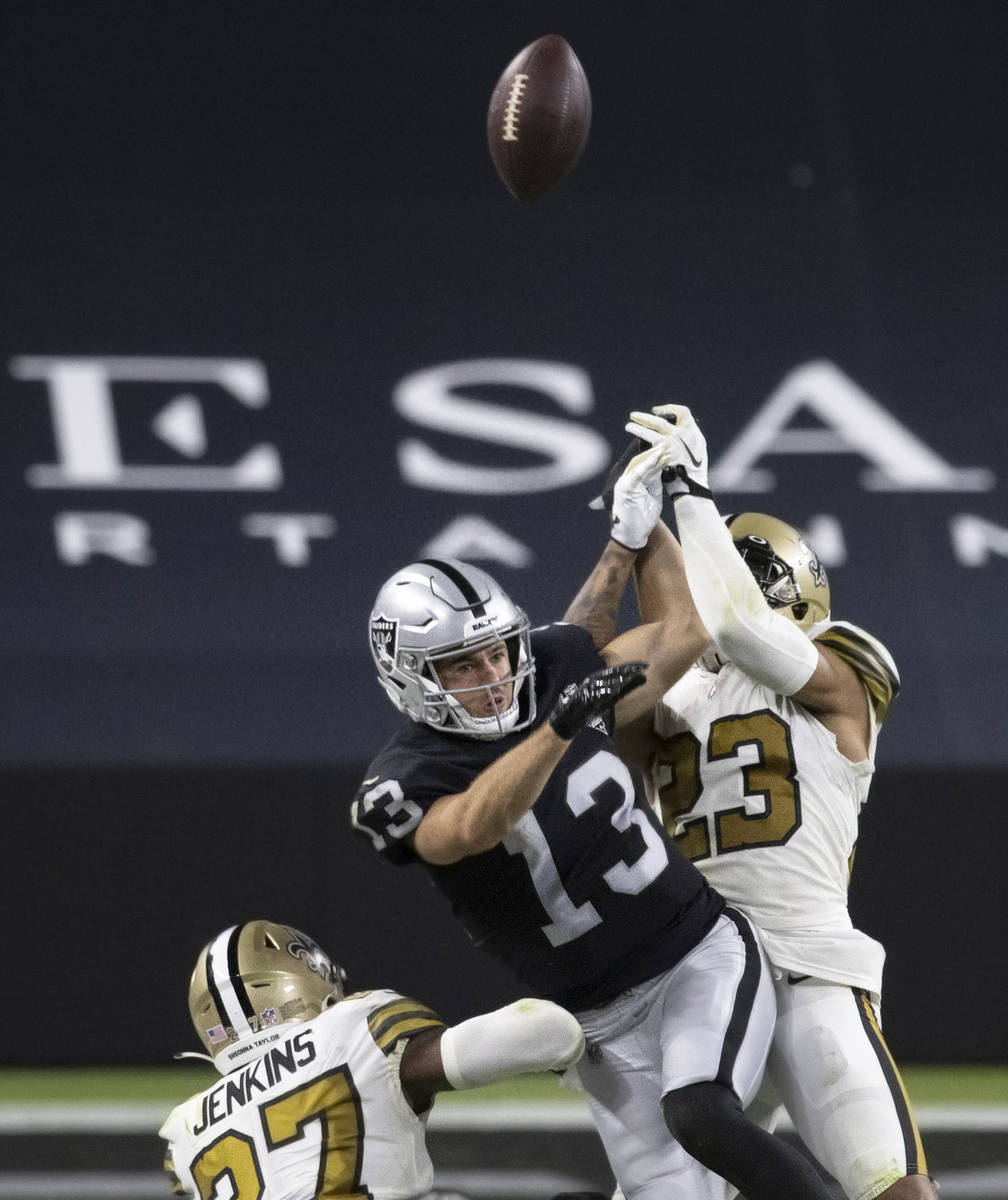 Las Vegas Raiders wide receiver Hunter Renfrow (13) has a pass broken up by New Orleans Saints ...