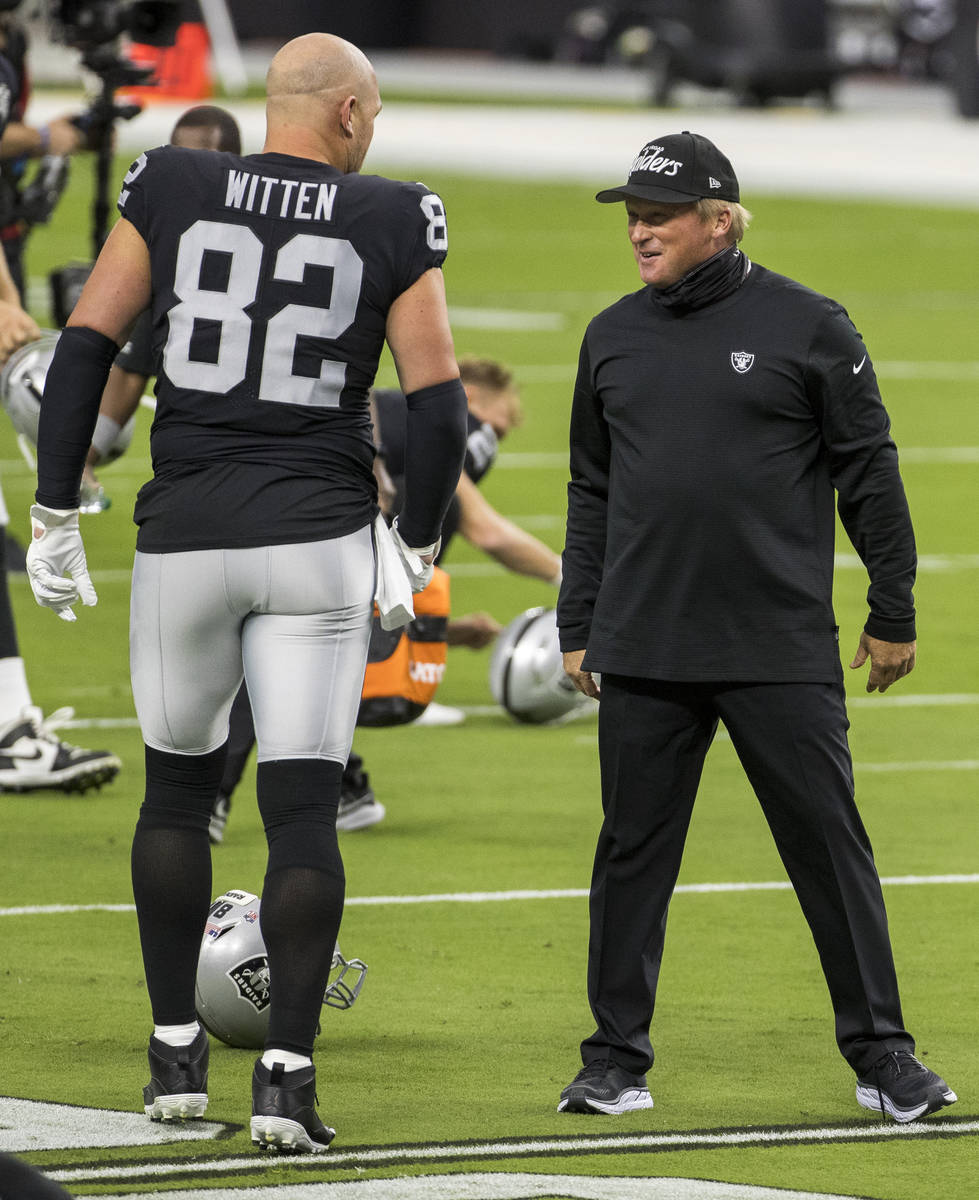 Las Vegas Raiders tight end Jason Witten (82, left) jokes around with head coach Jon Gruden dur ...