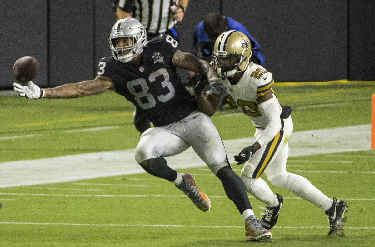 Las Vegas Raiders tight end Darren Waller (83, left) reaches out for critical catch over New Or ...