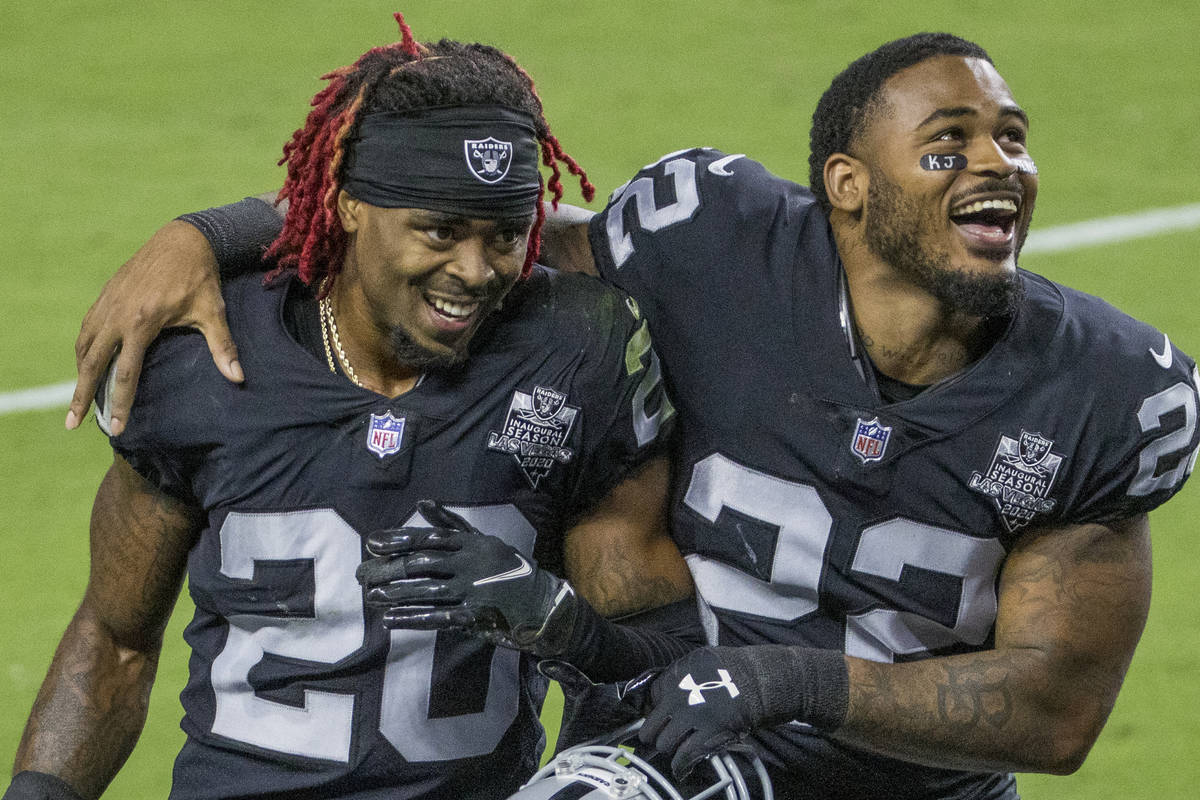 Las Vegas Raiders cornerback Damon Arnette (20) and cornerback Keisean Nixon (22) celebrate fol ...