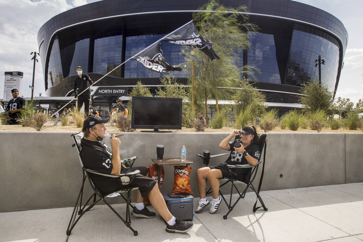 Las Vegas Raiders fans Kenna James, left, and Julie Goldman have their spot set up outside seve ...