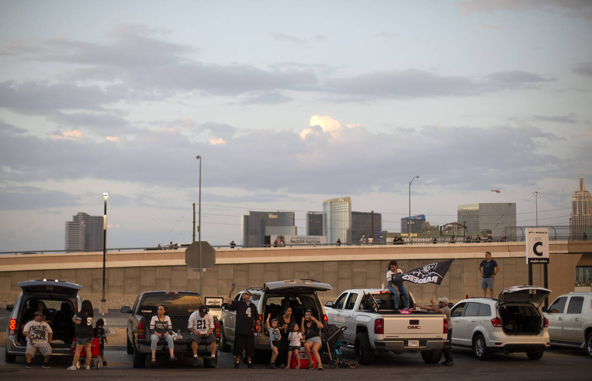 Raiders fans gather outside Allegiant Stadium for the Raiders' first home game on Monday, Sept. ...
