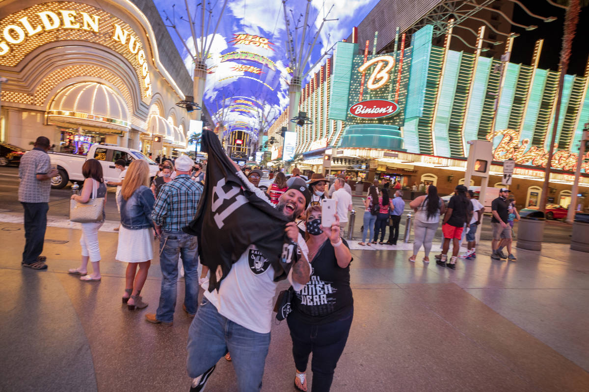 Raiders fans from Rio Rancho, New Mexico, Christopher Rodarte, left, and his mom Brenda Ortiz, ...