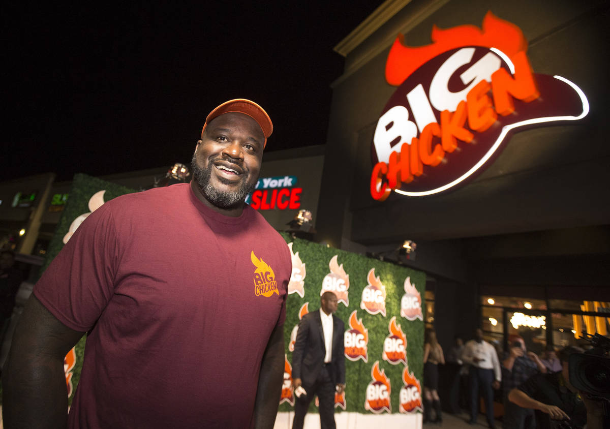 Retired NBA player Shaquille O'Neal smiles during the grand opening celebration of Big Chicken, ...