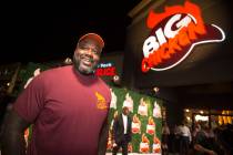 Retired NBA player Shaquille O'Neal smiles during the grand opening celebration of Big Chicken, ...