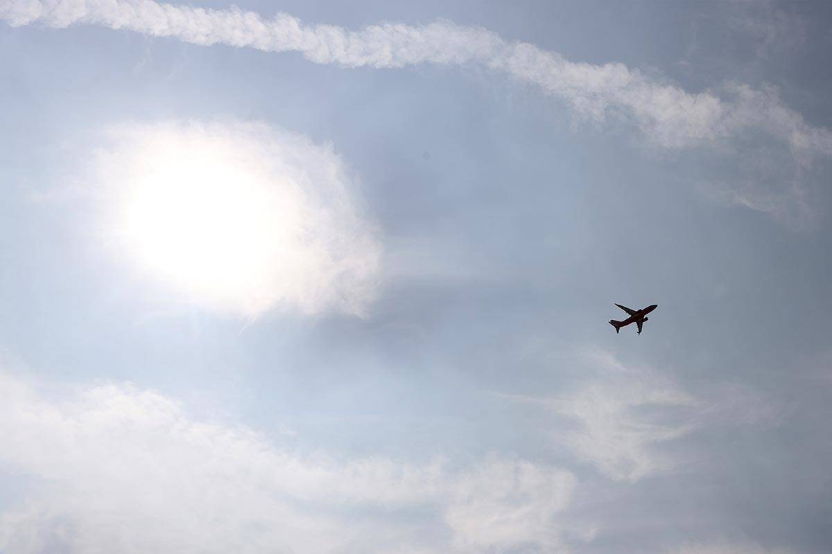 A plane departs McCarran International Airport in Las Vegas, Thursday, Sept. 17, 2020. Smoke an ...