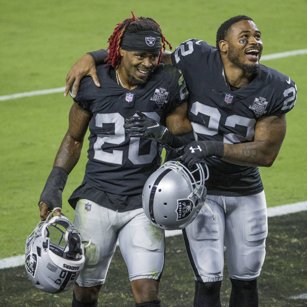 Las Vegas Raiders cornerback Damon Arnette (20) and cornerback Keisean Nixon (22) celebrate fol ...