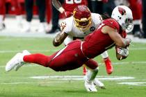 Arizona Cardinals wide receiver Larry Fitzgerald makes a catch as Washington Football Team line ...