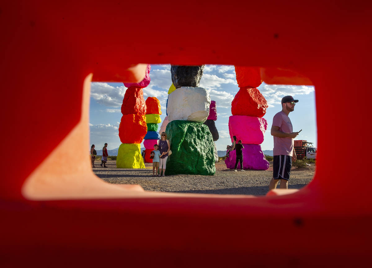 Visitors explore the newly restored Seven Magic Mountains art installation on June 18. (L.E. Ba ...