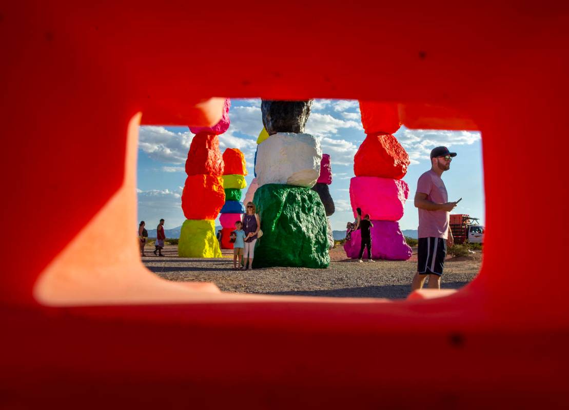 Visitors explore the newly restored Seven Magic Mountains art installation on June 18. (L.E. Ba ...