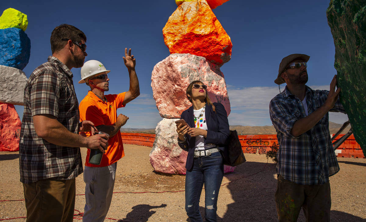 Amanda Horn of the Nevada Museum of Art inspects the progress with representatives from Studio ...
