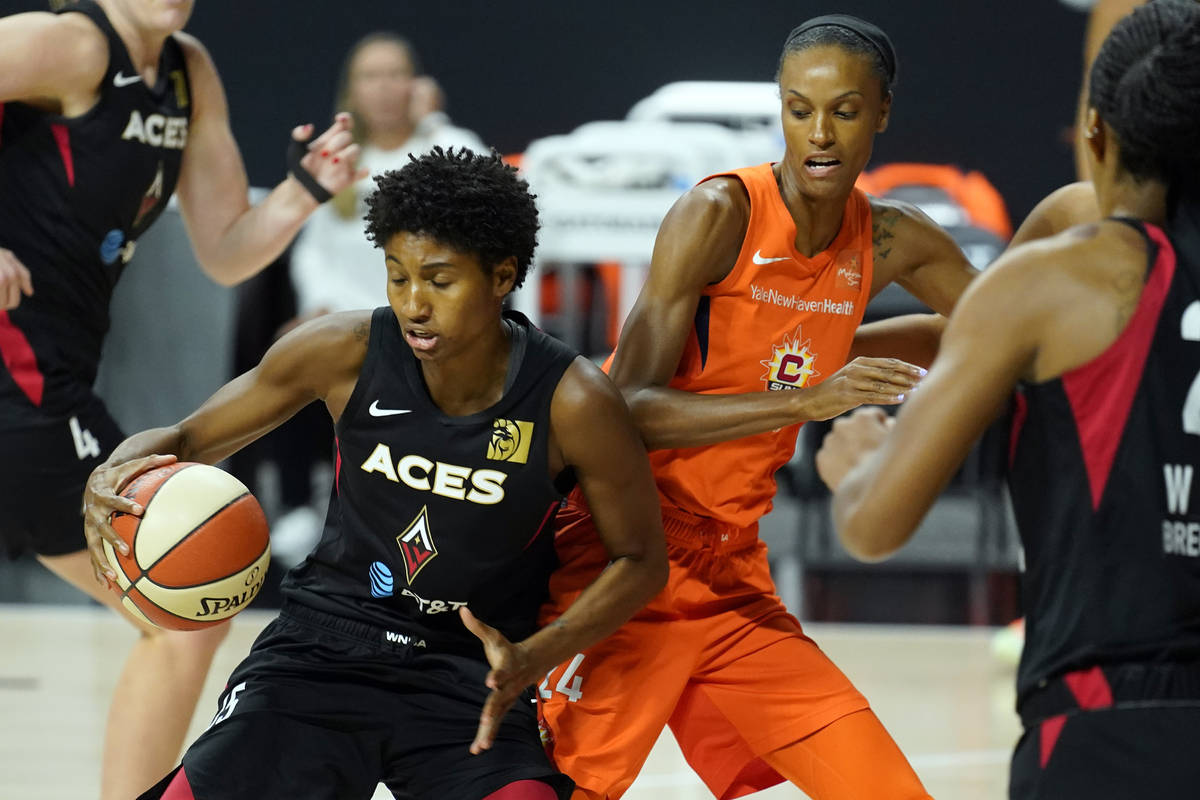 Las Vegas Aces forward Angel McCoughtry (35) runs into Connecticut Sun forward DeWanna Bonner ( ...