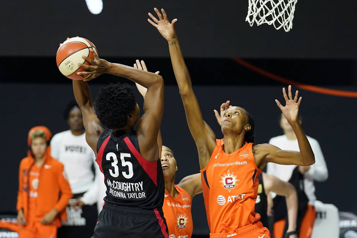 Connecticut Sun forward DeWanna Bonner (24) goes up to block a shot by Las Vegas Aces forward A ...