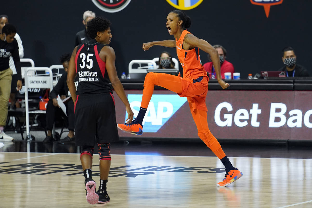 Connecticut Sun forward DeWanna Bonner (24) celebrates her three-point basket in front of Las V ...