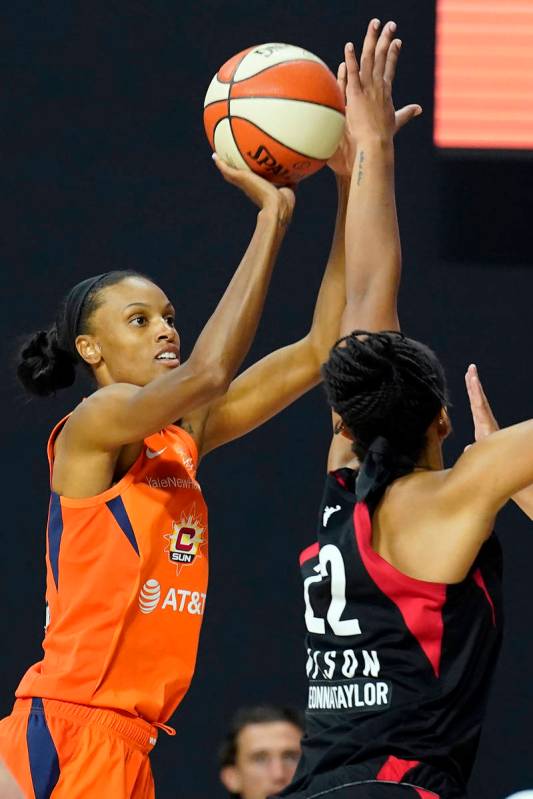 Connecticut Sun forward DeWanna Bonner (24) shoots over Las Vegas Aces center A'ja Wilson (22) ...