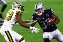 Las Vegas Raiders tight end Darren Waller (83) tries to get around New Orleans Saints free safe ...