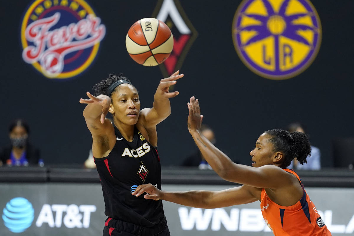Las Vegas Aces center A'ja Wilson (22) passes the ball in front of Connecticut Sun forward Alys ...