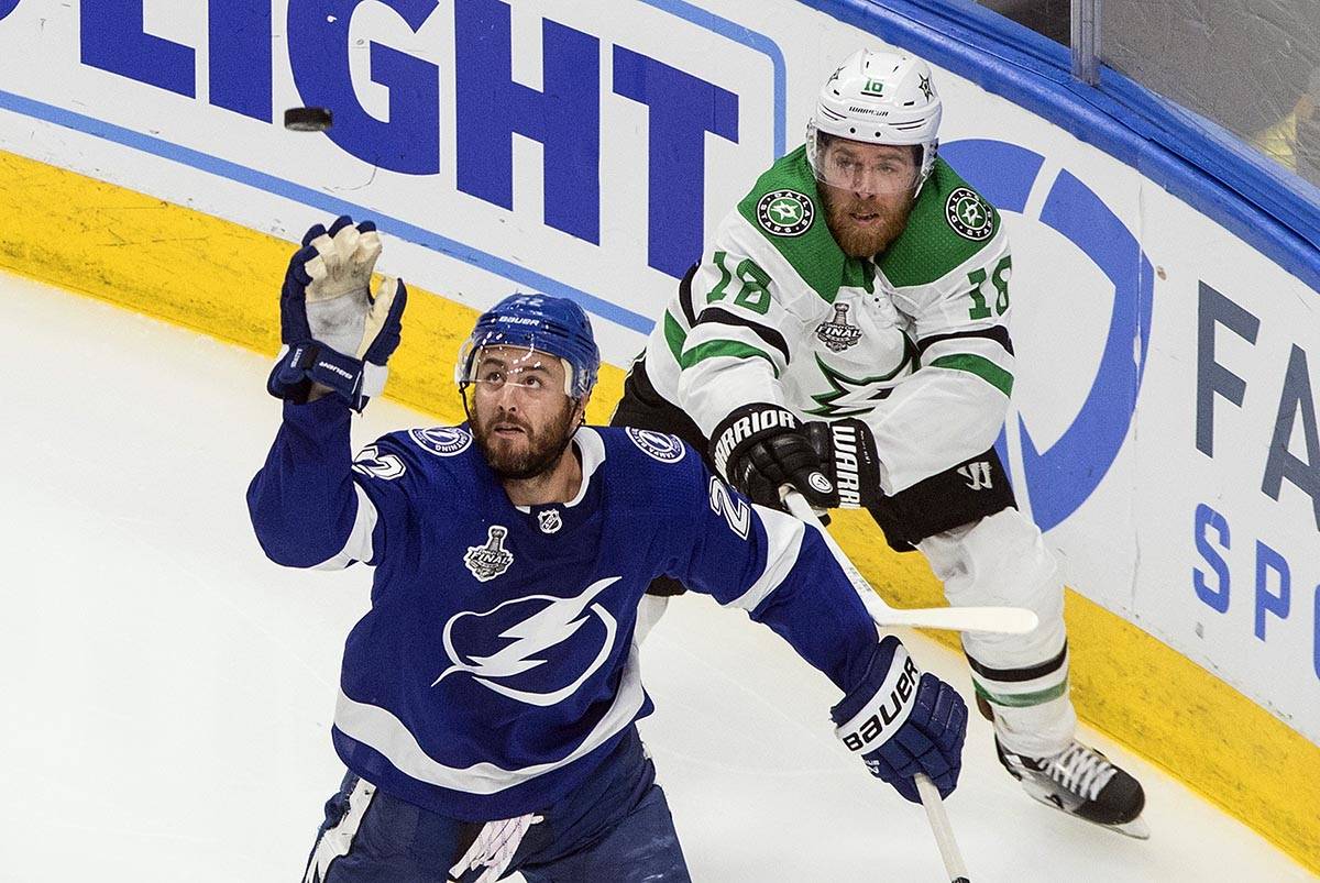Dallas Stars' Joe Pavelski (16) and Tampa Bay Lightning's Kevin Shattenkirk (22) battle for the ...
