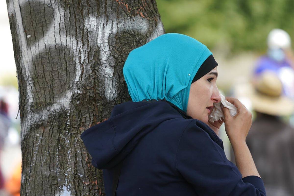 A woman reacts to news in the Breonna Taylor shooting, Wednesday, Sept. 23, 2020, in Louisville ...
