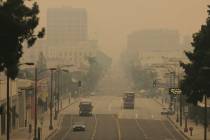 Smoke from wildfires fills the sky over Pasadena, Calif. (AP Photo/John Antczak)