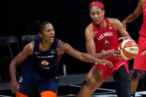 Connecticut Sun forward Alyssa Thomas (25) knocks the ball away from Las Vegas Aces center A'ja ...