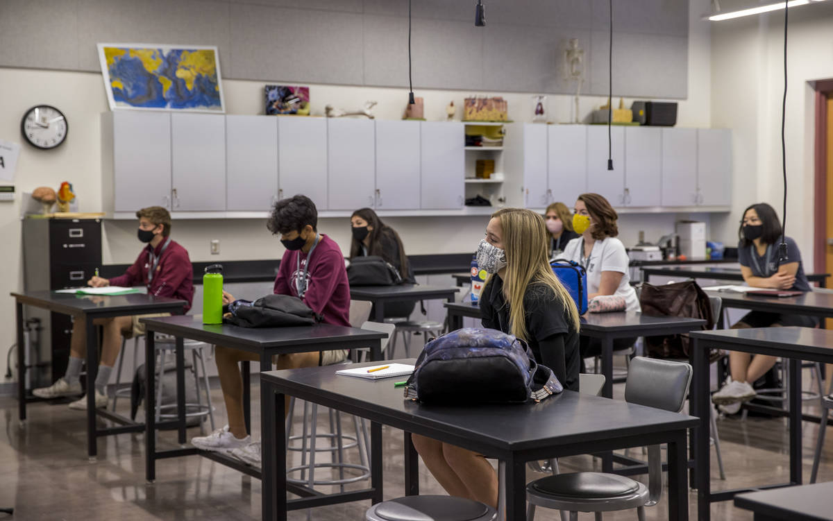 Students keep socially distanced while attending Steve MorrillÕs anatomy and physiology cl ...