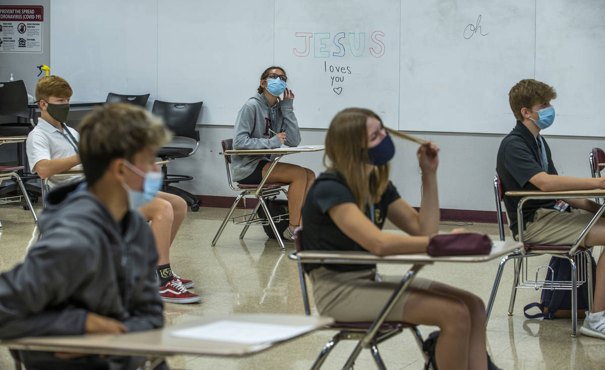 Students keep socially distanced while attending Joel Arnold's world history class at the Faith ...