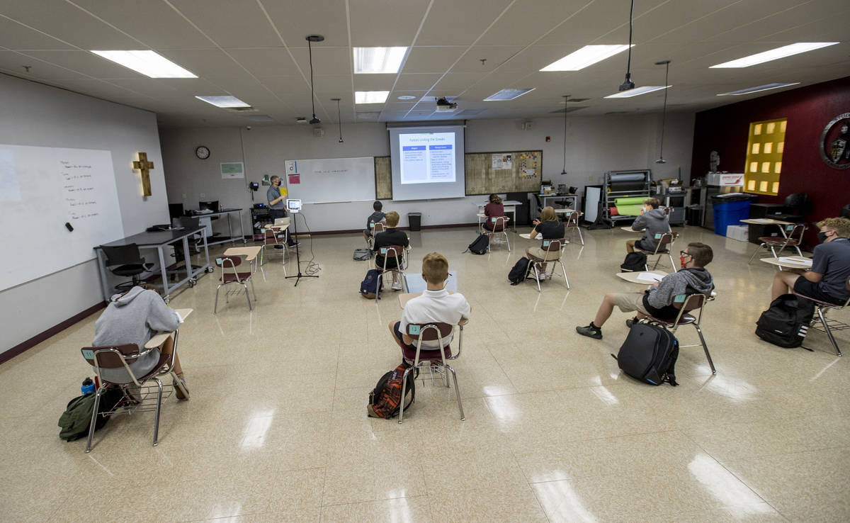 Students keep socially distanced while attending Joel ArnoldÕs world history class at the ...