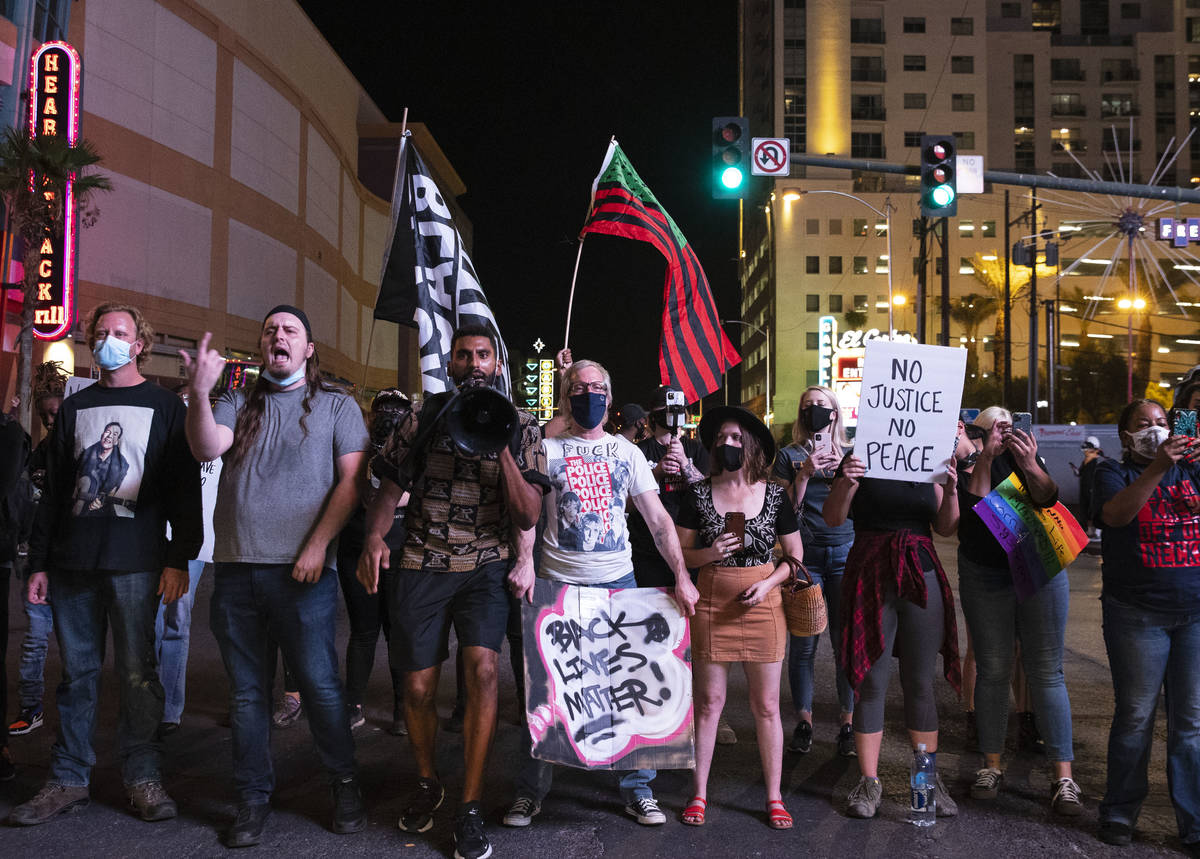 Protesters, calling for justice in the shooting death of Breonna Taylor, block Las Vegas Boulev ...