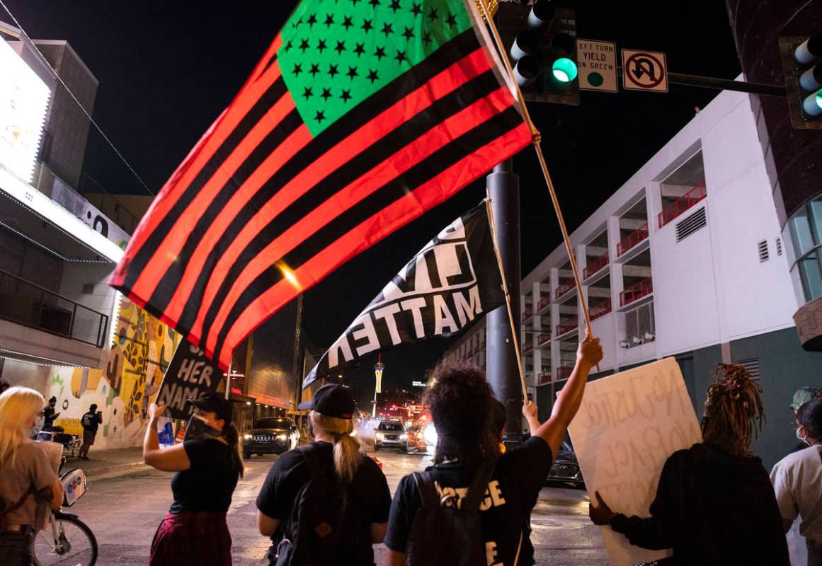 Protesters, calling for justice in the shooting death of Breonna Taylor, block Las Vegas Boulev ...