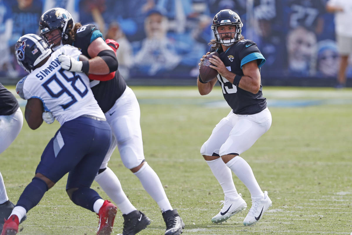 Jacksonville Jaguars quarterback Gardner Minshew (15) passes against the Tennessee Titans in th ...