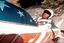 Evel Knievel sits in a steam-powered rocket motorcycle at Snake River Canyon in Twin Falls, Ida ...