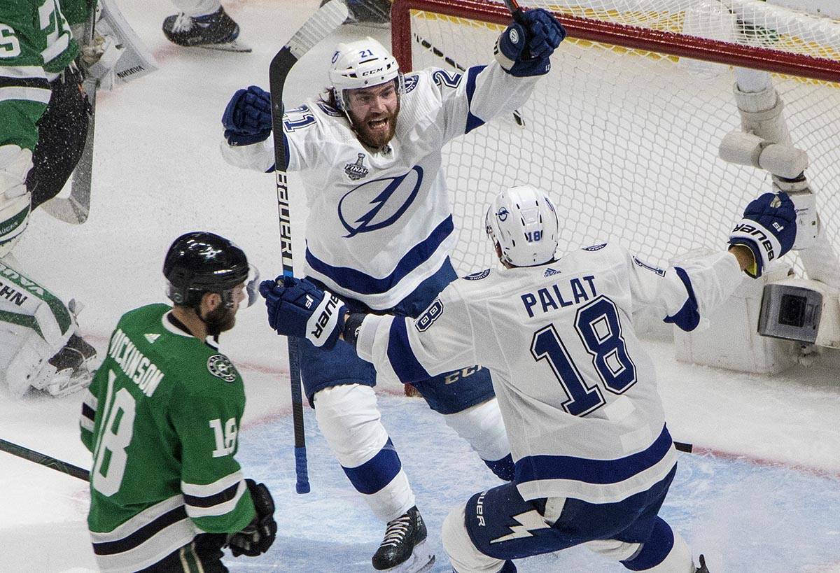 Tampa Bay Lightning center Brayden Point (21) celebrates his goal with Ondrej Palat, right, as ...