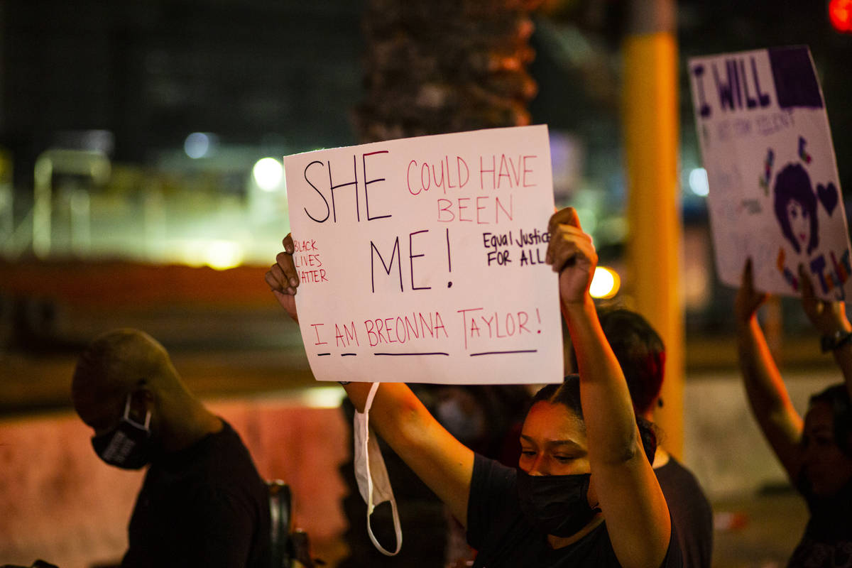 Protesters march along the Las Vegas Strip to call for justice for Breonna Taylor on Thursday, ...