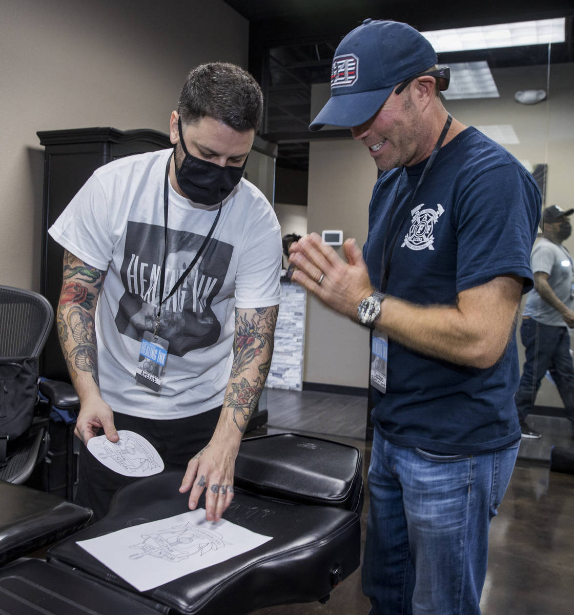 Tattoo artist Jim Sylvia, left, shows a sketch to Dean McAuley as Route 91 shooting survivors a … | Las Vegas Review-Journal Tattoo artist Jim Sylvia, left, shows a sketch to Dean McAuley as Route 91 shooting survivors a … | Las Vegas Review-Journal