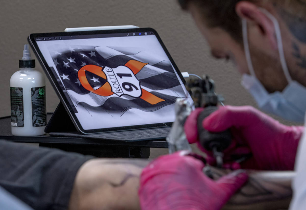 Tattoo artist Jimmy Snaz recreates his computer drawing on Joe Gerransnas Route 91 shooting sur ...