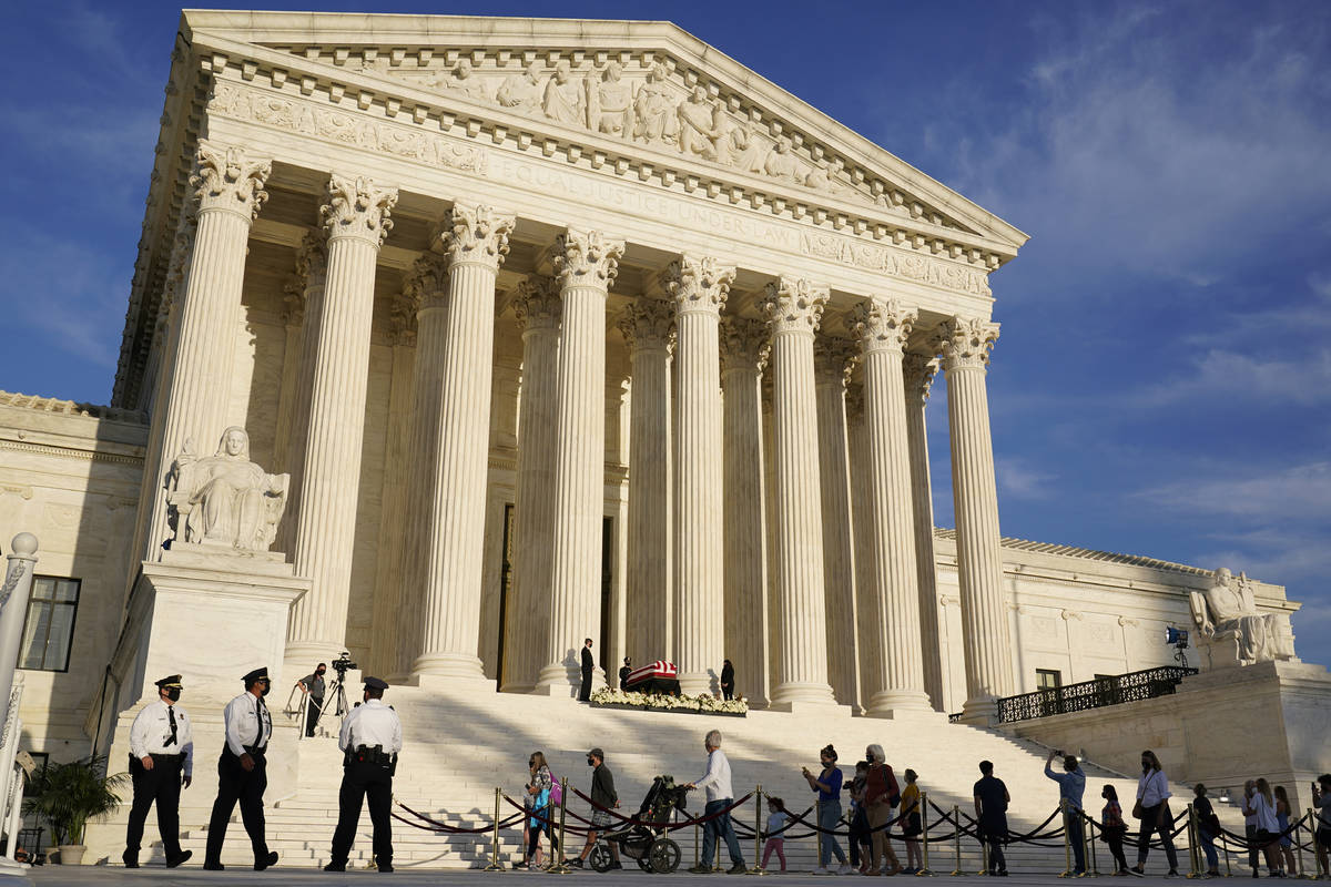 People pay respects as Justice Ruth Bader Ginsburg lies in repose under the Portico at the top ...