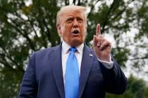 President Donald Trump speaks to members of the press on the South Lawn of the White House in W ...