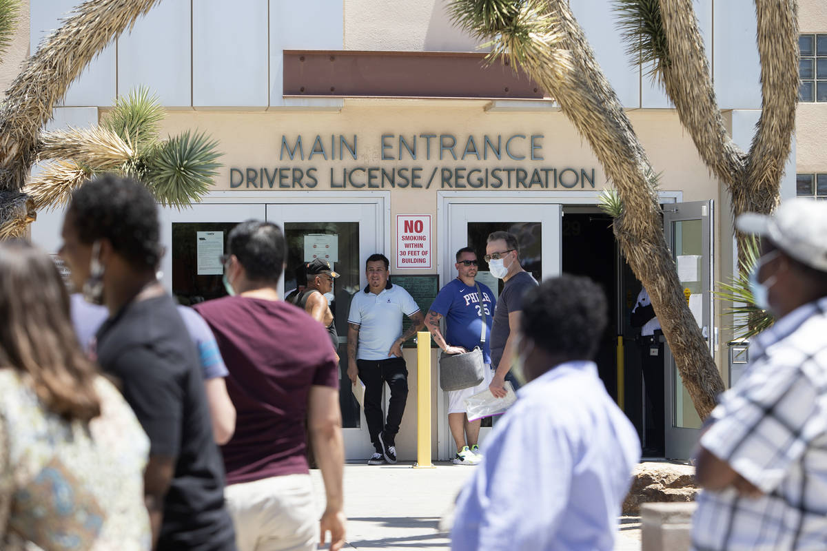 People wait in line at the Nevada Department of Motor Vehicles at 8250 West Flamingo Road on Mo ...