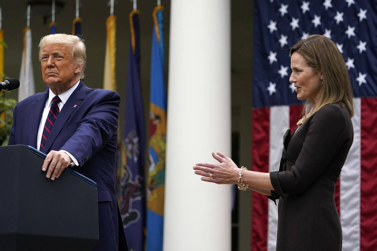 Judge Amy Coney Barrett applauds as President Donald Trump announces Barrett as his nominee to ...