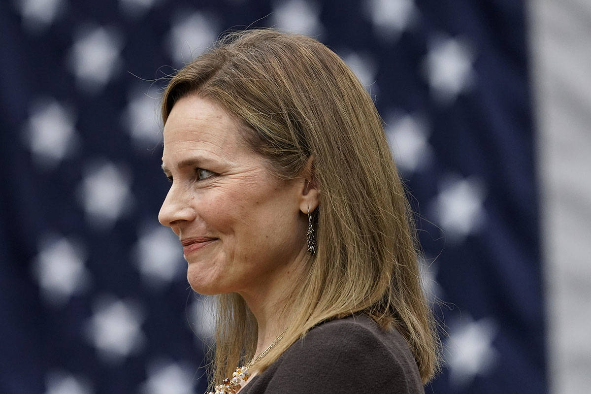 Judge Amy Coney Barrett listens as President Donald Trump announces Barrett as his nominee to t ...