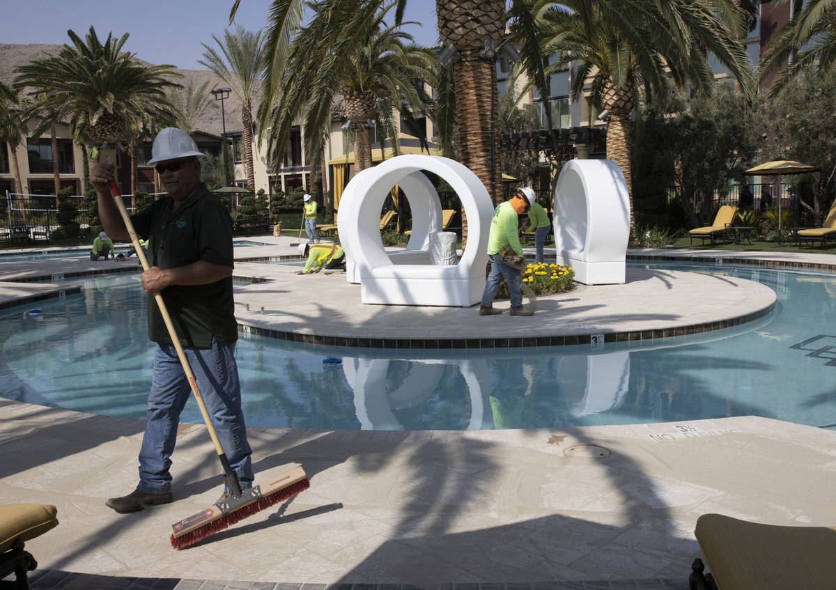 Crews are working at pool area at the Tuscan Highlands apartment complex under construction nea ...