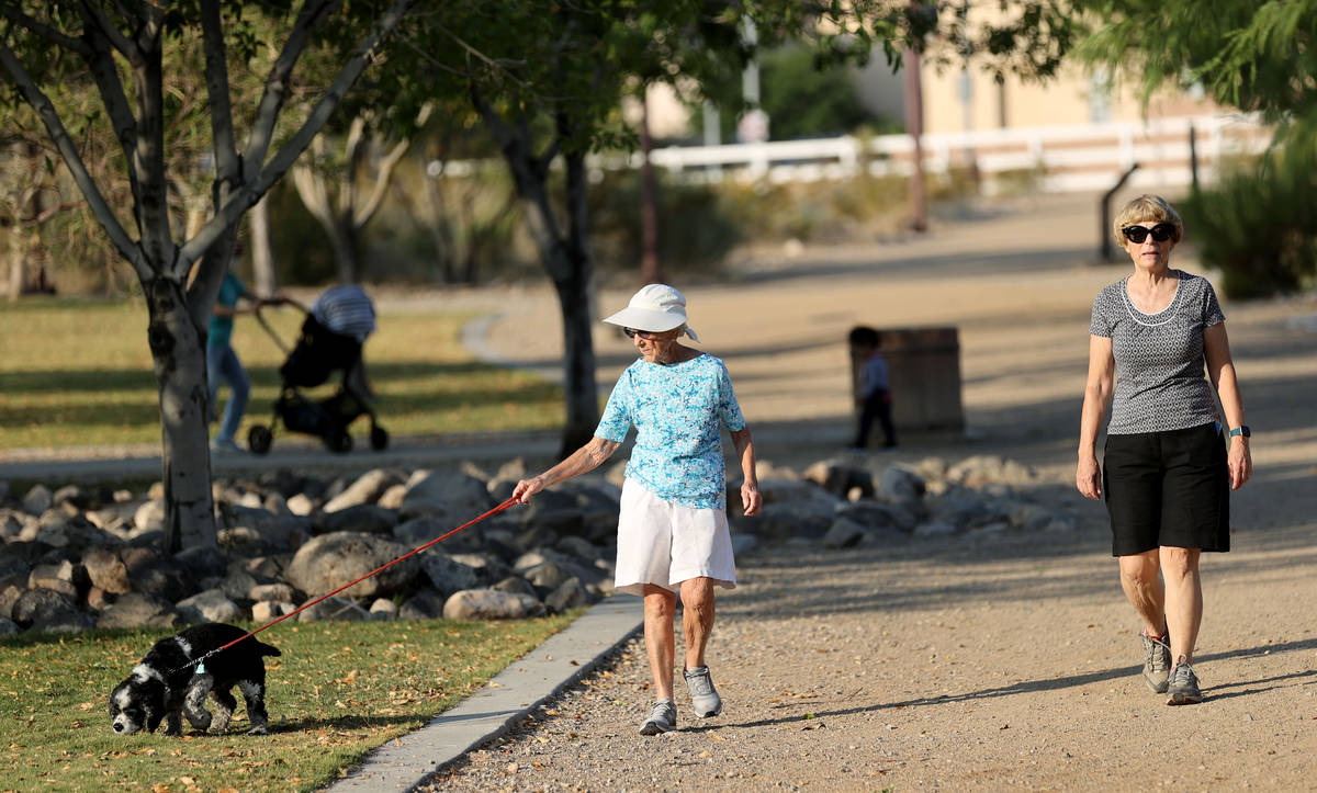 Katie Craven, right, 67, and her mother, Ruth Sidorowicz, 91, walk Sidorowicz's cocker spaniel ...