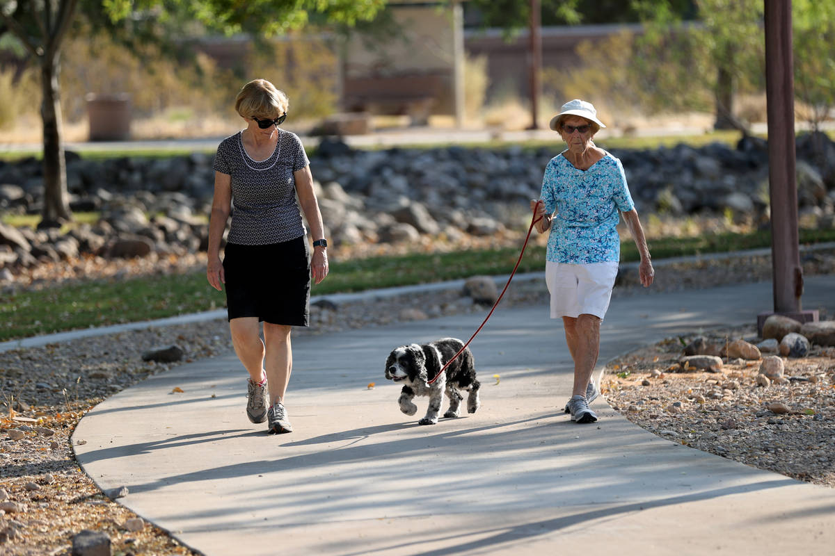 Katie Craven, left, 67, and her mother, Ruth Sidorowicz, 91, walk Sidorowicz's cocker spaniel G ...