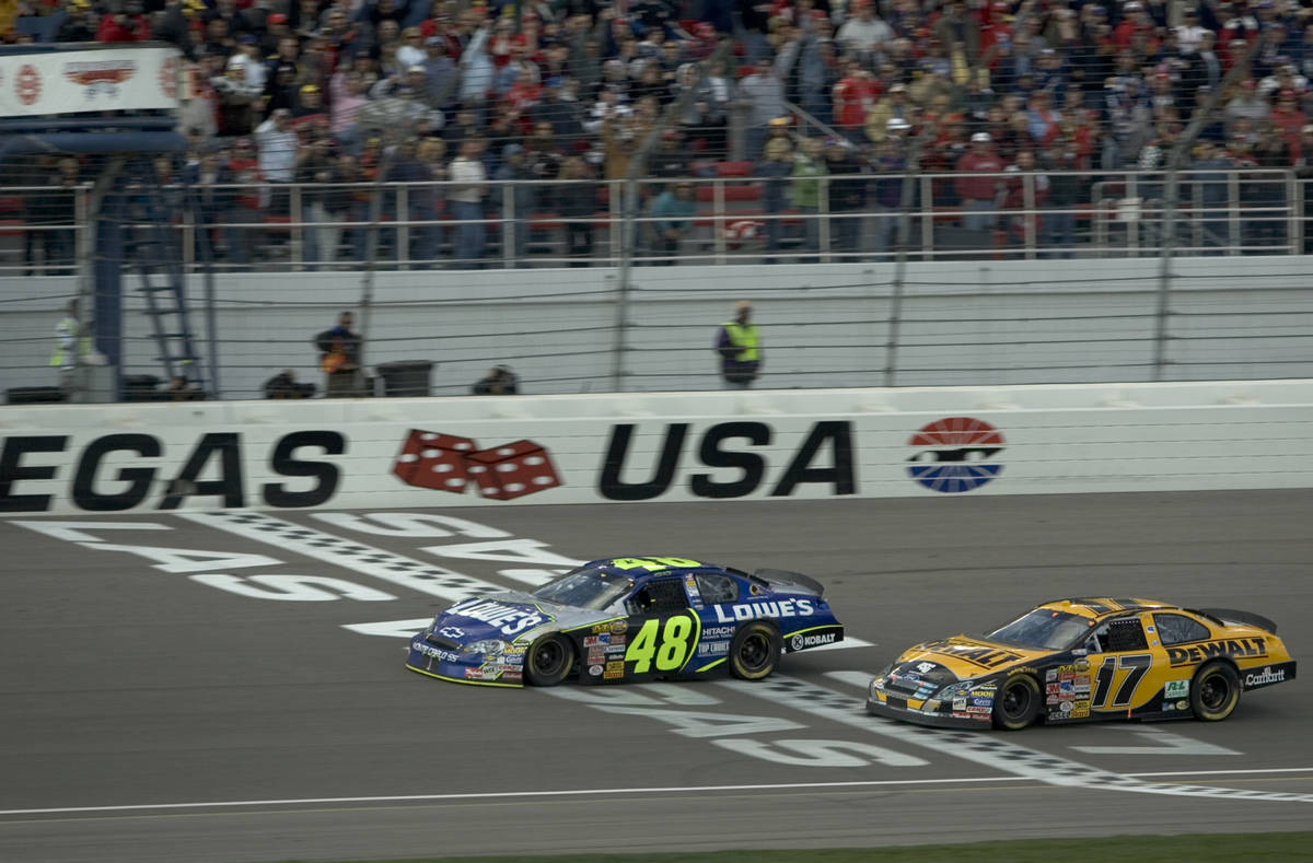RJ FILE*** SPORTS - Jimmie Johnson takes the checkered flag a few feet ahead of Matt Kenseth in ...