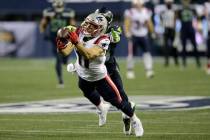 New England Patriots wide receiver Julian Edelman makes a diving catch in front of Seattle Seah ...