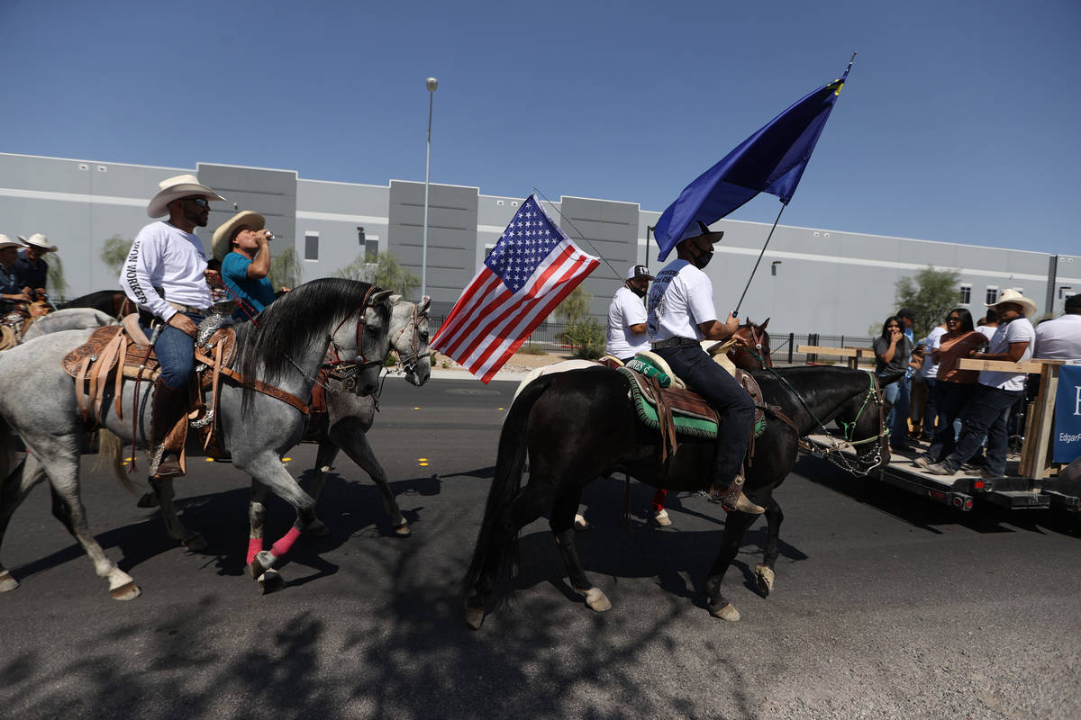 Horseback riders participate in the re-election campaign event for Assemblyman Edgar Flores in ...