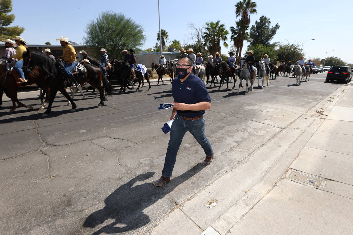 Assemblyman Edgar Flores canvasses with supporters in his east Las Vegas neighborhood, Saturday ...