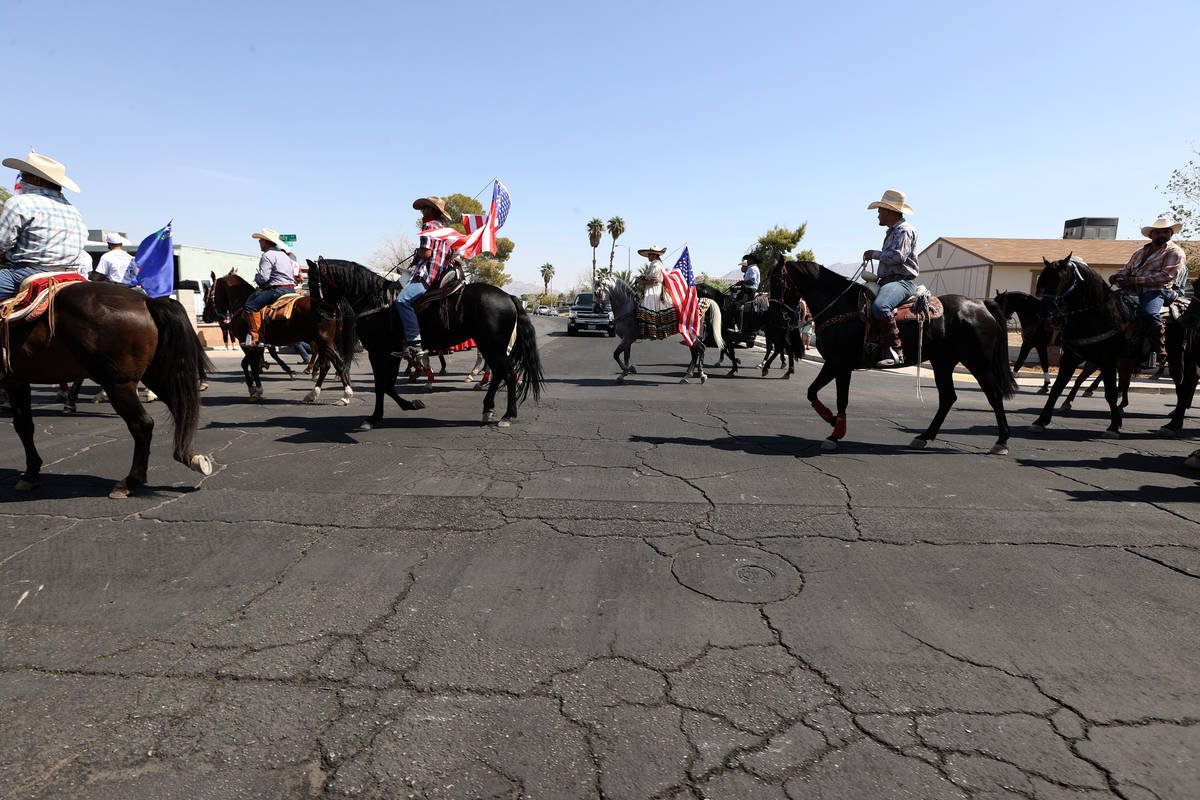 Horseback riders participate in the re-election campaign event for Assemblyman Edgar Flores in ...