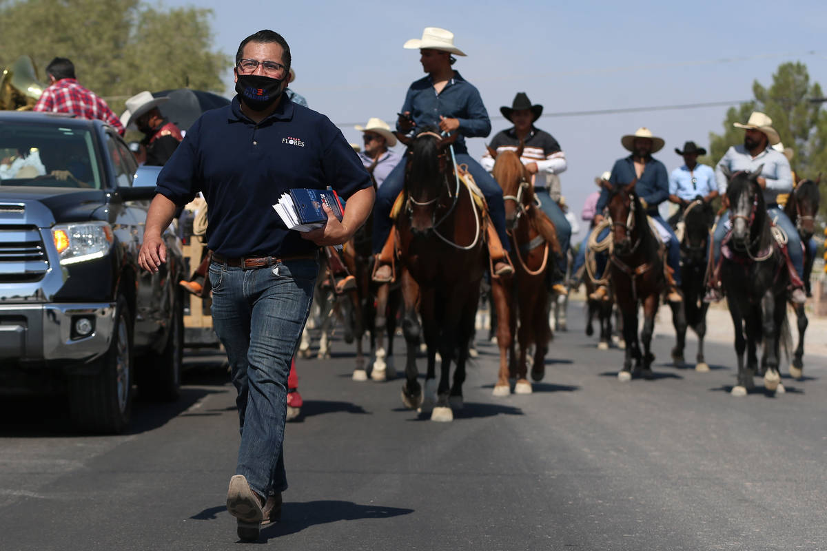 Assemblyman Edgar Flores canvasses in his east Las Vegas neighborhood, Saturday, Sept. 26, 2020 ...